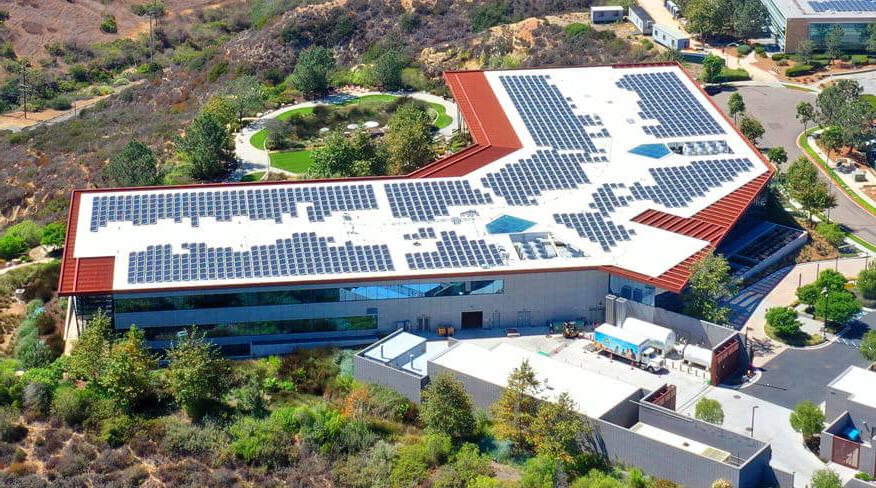 Aerial view of the roof of a building with solar panels